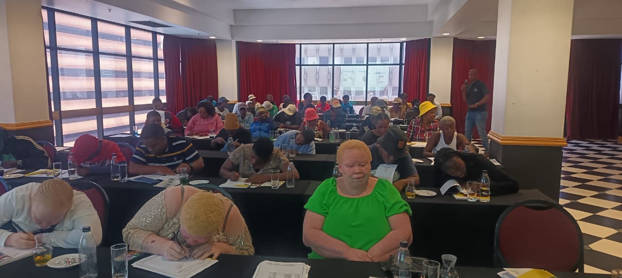 Workshop participants with person in green shirt